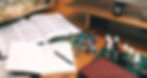 Dungeons & Dragons session setup with rulebooks, miniatures, dice, and campaign notes