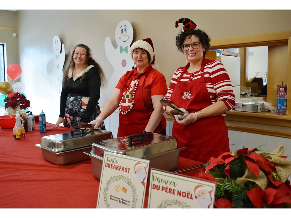 Volunteers help serve families during the Santa Breakfast at the New Brunswick Military Family Resource Centre in Oromocto, N.B., part of the centre’s annual holiday events. Heather Banks/Contributed