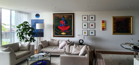Wall decorated with a variety of different art pieces | Featured Image for home page for FORWALLS.