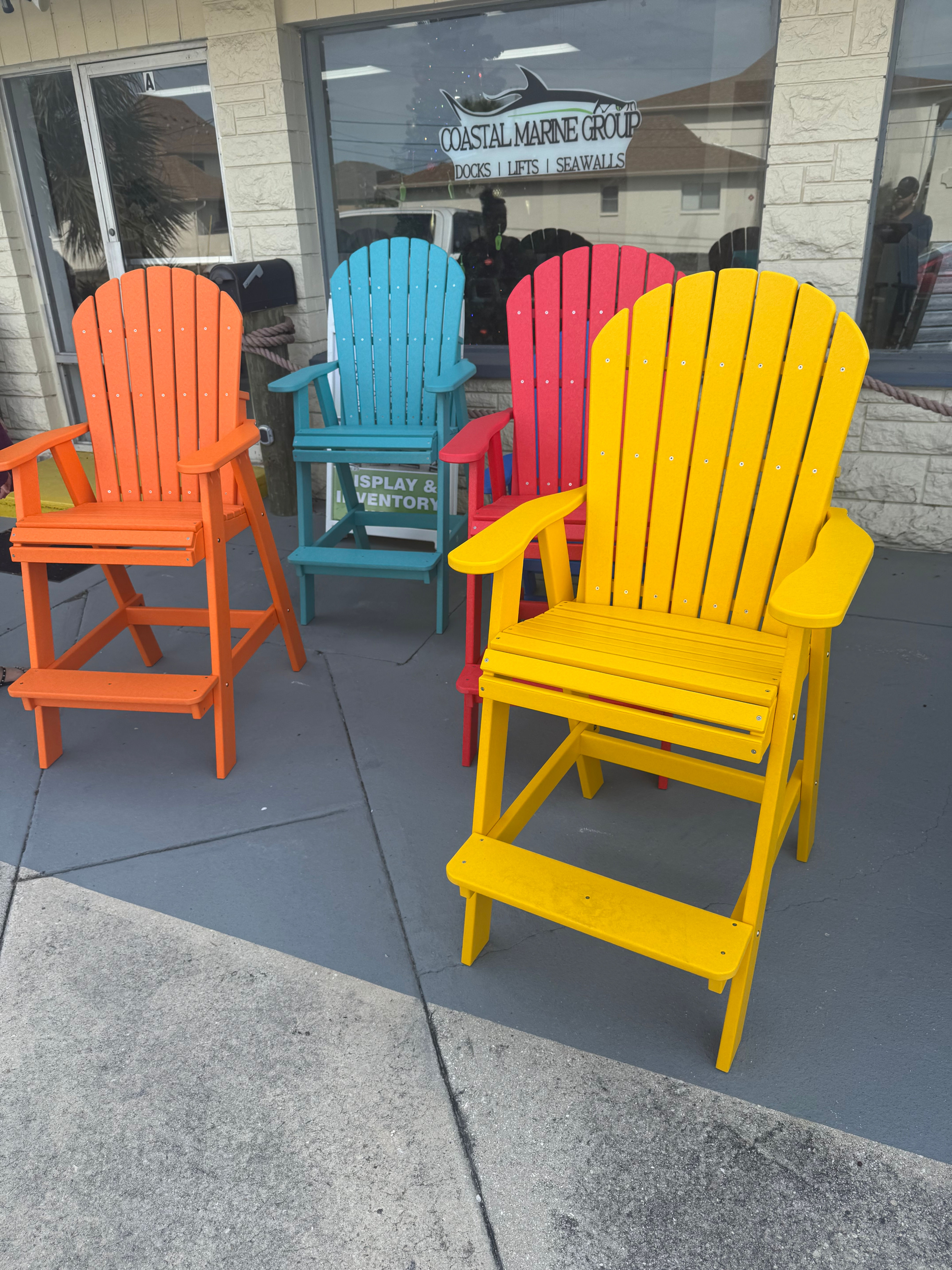 patio chairs in red, yellow, orange and aruba