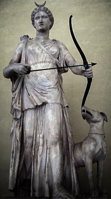 Statue of goddess Artemis/Diana, wearing a crescent Moon crown, holding her bow. With a faithful dog by her side