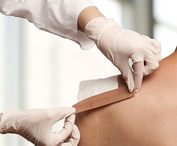 Taping a shoulder wound
