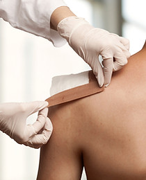 Taping a shoulder wound