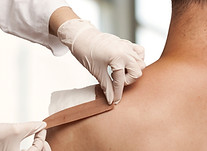 Taping a shoulder wound
