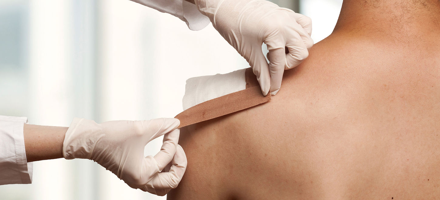 Taping a shoulder wound