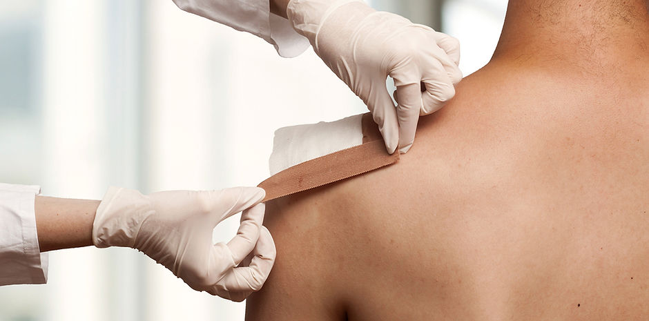 Taping a shoulder wound