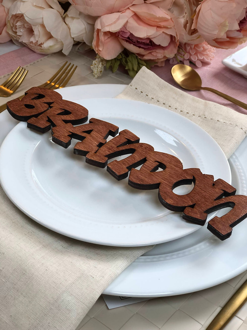 Graffiti-inspired wooden name piece used as event decor