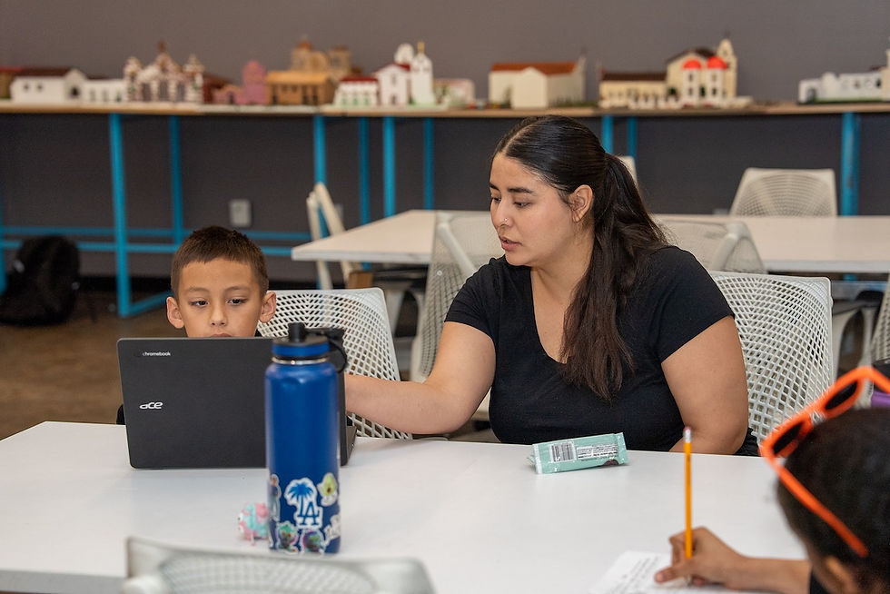 A Central Academy of Arts and Technology teacher works one-to-one with a student.