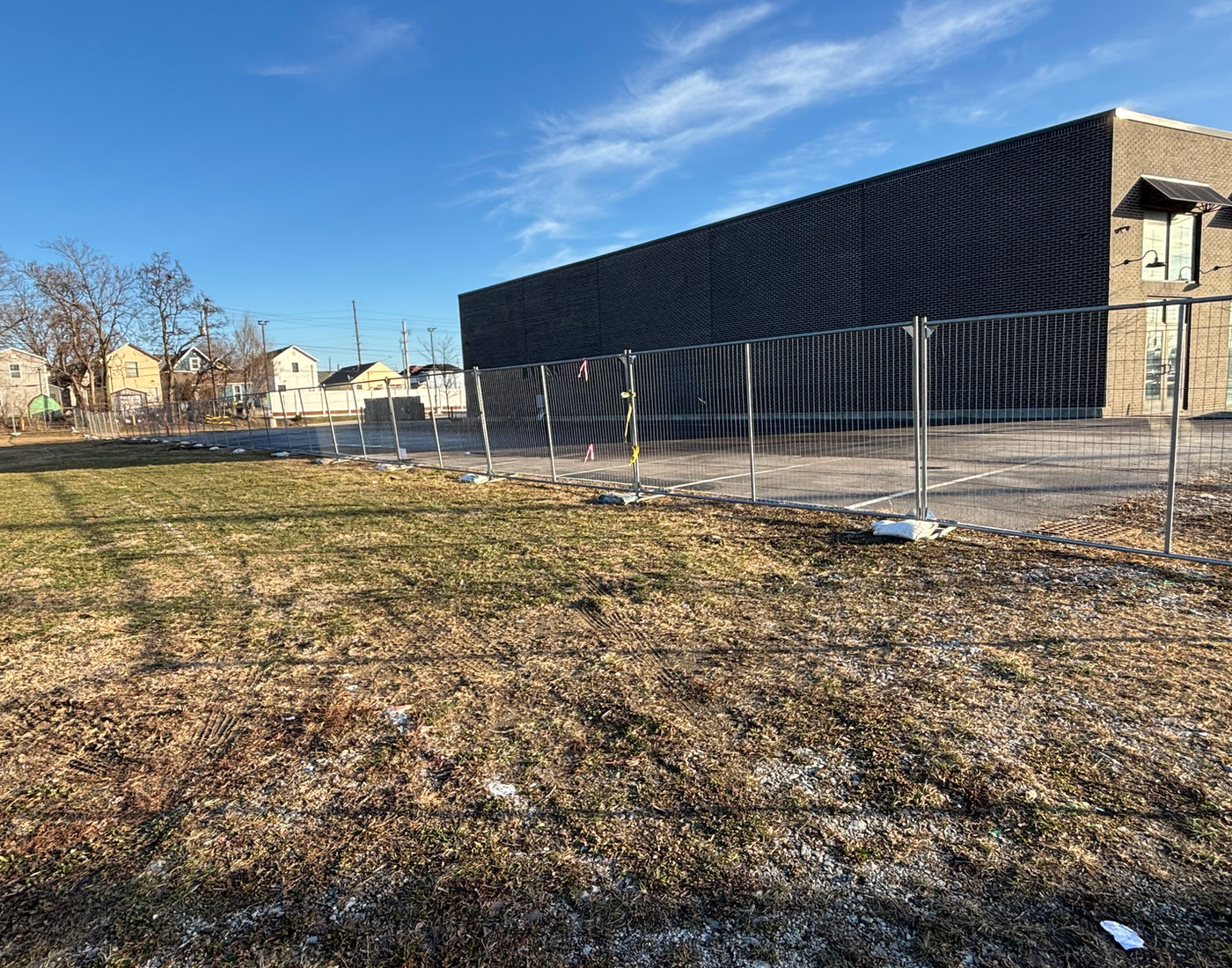 Post driven temporary chain link fence around a hotel build near Morris and Madison in Indianapolis