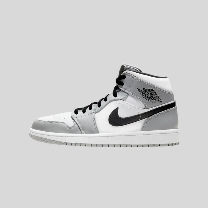 Zapatillas Air Jordan 1 Mid grises y blancas
