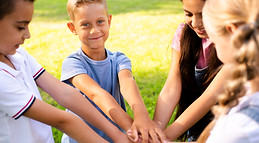 cheerful-children-joining-hands-together.jpg