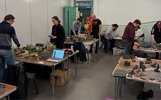 Two photos in a collage, both showing groups of people gathered around tables with small figurines and game boards.