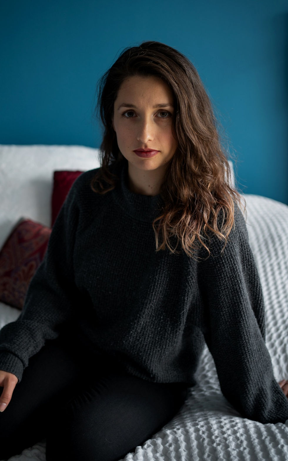 Andreana, sitting and looking at camera