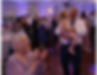 Three generations of wedding guests join in to sing along to a party anthem.