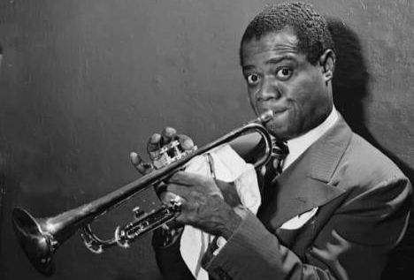Louis Armstrong—proof that joy and gravity could exist inside the same human voice without contradiction