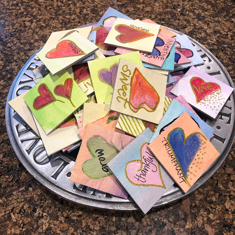 A plate full of love; mini paintings of hearts.