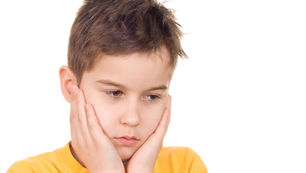 A boy troubled and unhappy ADHD distraction