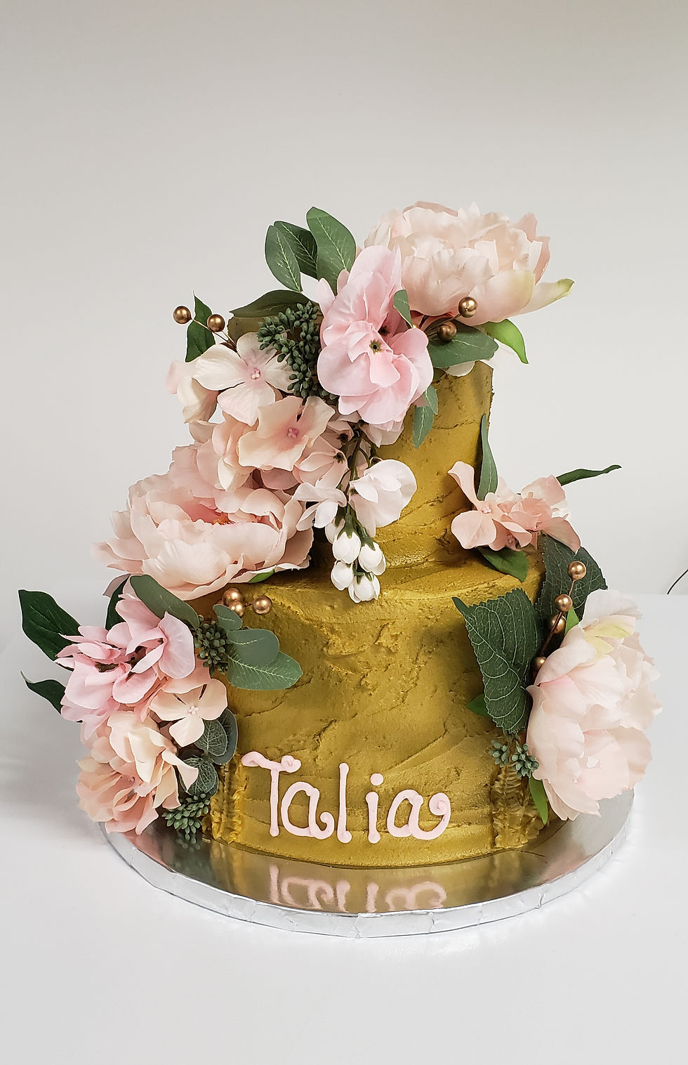 Gold, garden themed wedding cake