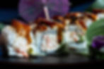 sushi roll covered in sauce