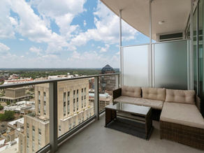 luxury apartment rental with a private balcony and skyline view