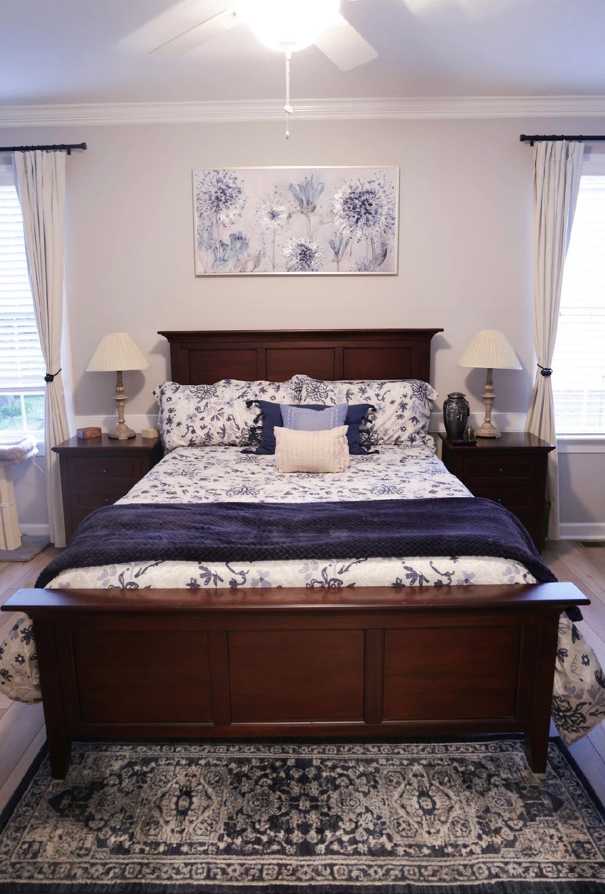 Bedroom with dark wood bed and blue accents