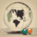 a big globe behind 2 billiards balls 1 dark turquoise 1 dark orange sitting together to the right of the globe