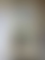 White wall clock with stained glass detail