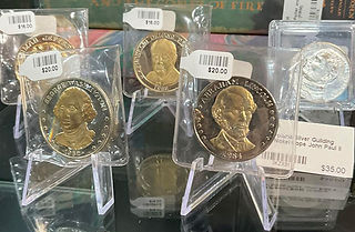 Collectible coins on acrylic stands
