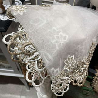 Delicate dresser scarves with embroidered detail