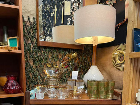 Mid-century modern bar cart vignette in antique mall