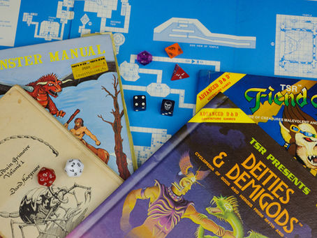 Dungeons & Dragons books and dice set with character sheets