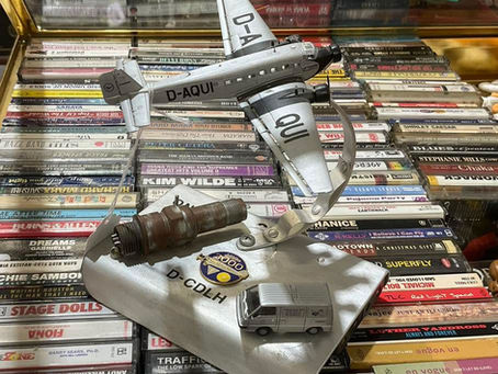 Vintage die-cast airplane on stand