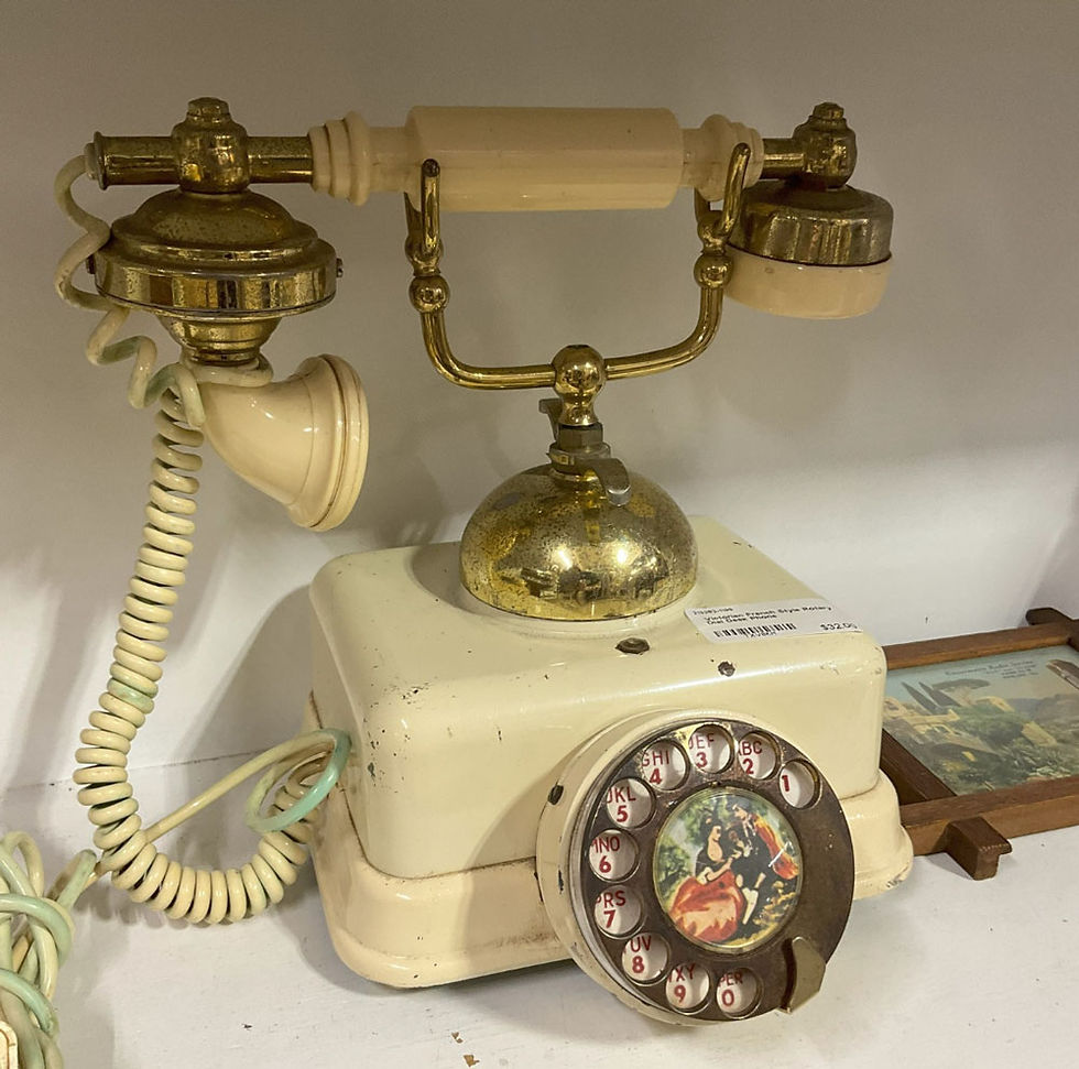 Antique cream rotary phone with cradle