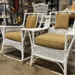 Vintage white wicker chairs with cushions