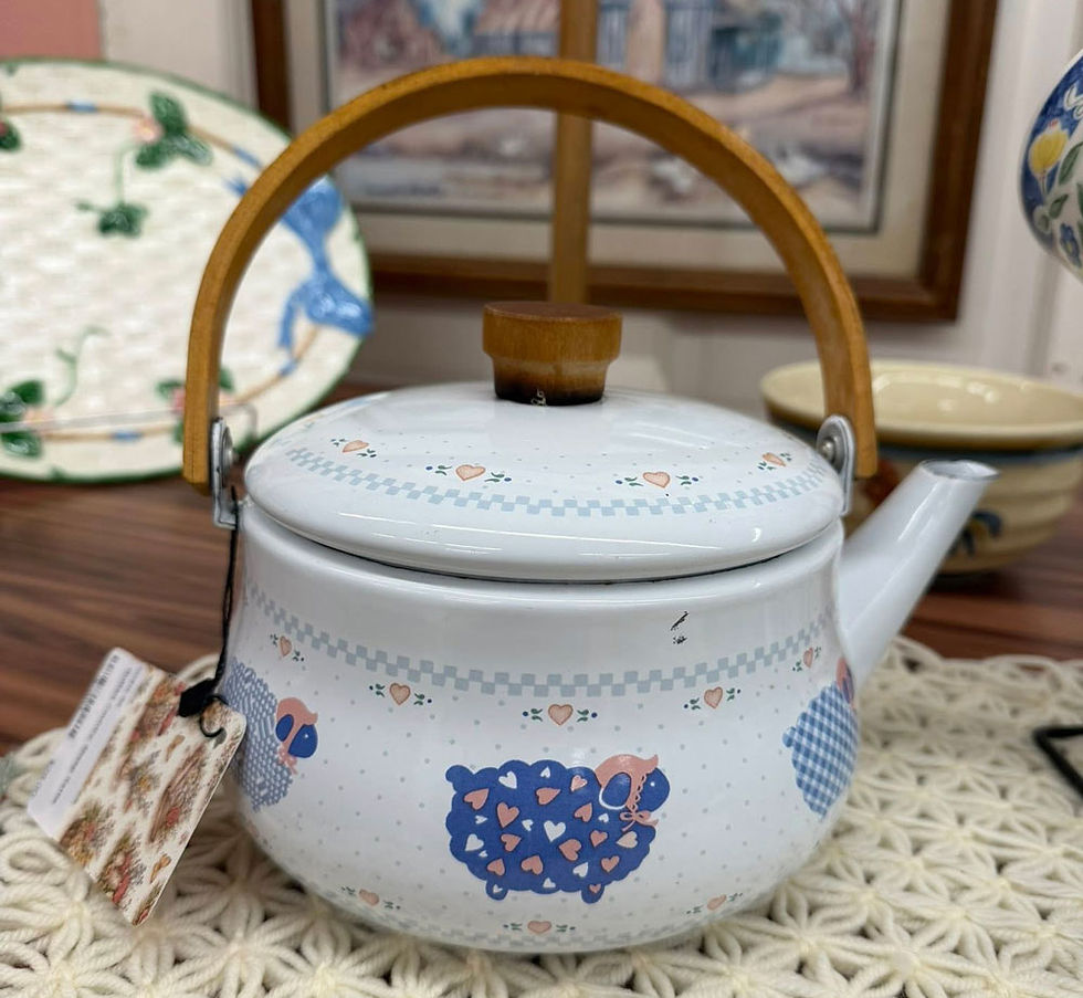 Vintage enamel teapot with sheep pattern