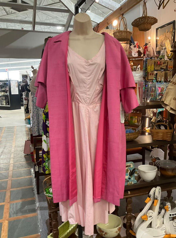Mannequin wearing vintage pink dress and jacket