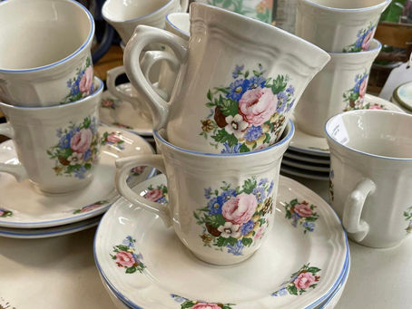 Vintage teacups and saucers with cottagecore floral design