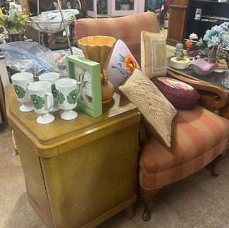 Vintage accent chair and blonde wood side table