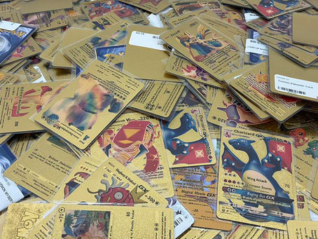 Stack of collectible Pokémon cards in vendor booth