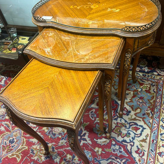 Three antique nesting side tables