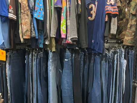 Vintage denim and t-shirts in vendor booth