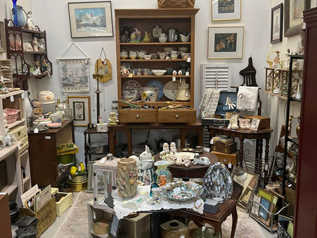 Antique mall booth with home décor and vintage collectibles