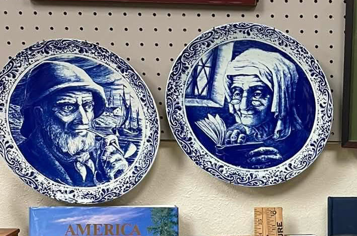 Blue and white portrait plates on wall