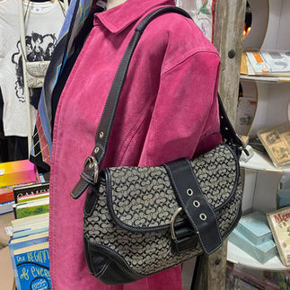 Collectible coach bag on mannequin