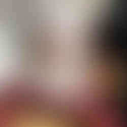 Cat figurine on vintage books