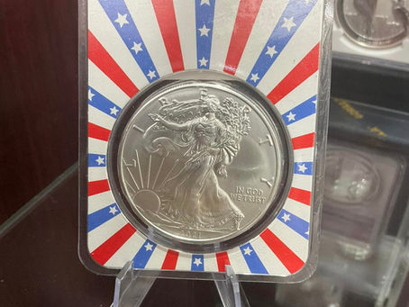 Collectible coin in red, white, and blue display cover
