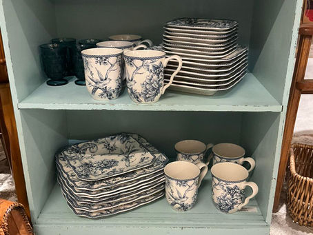 Shelf of vintage blue and white dishes