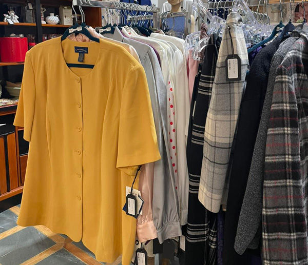 Rack of vintage shirts and jackets in antique mall