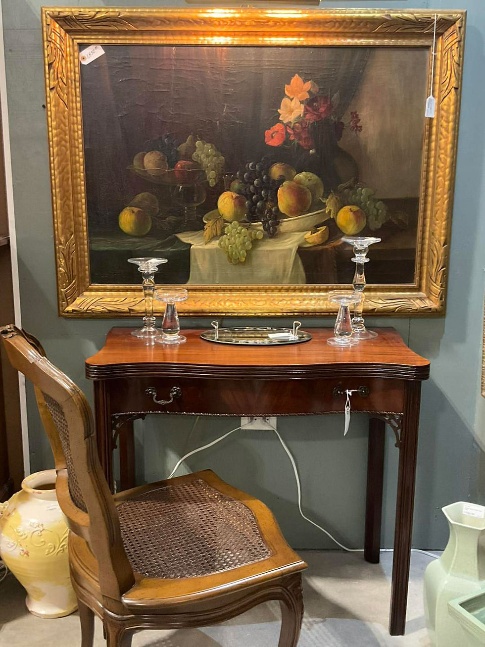 Vintage fruit painting over hall table and chair