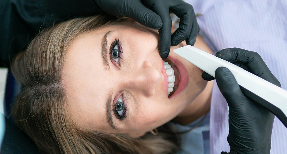 Woman at dentist, digital scan in progress